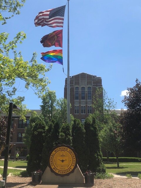 A Pride flag flying at Central Michigan University.