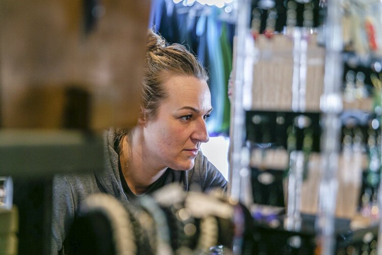 Freeland resident Veronica Cain, 32, examines items at All Things Divine. 