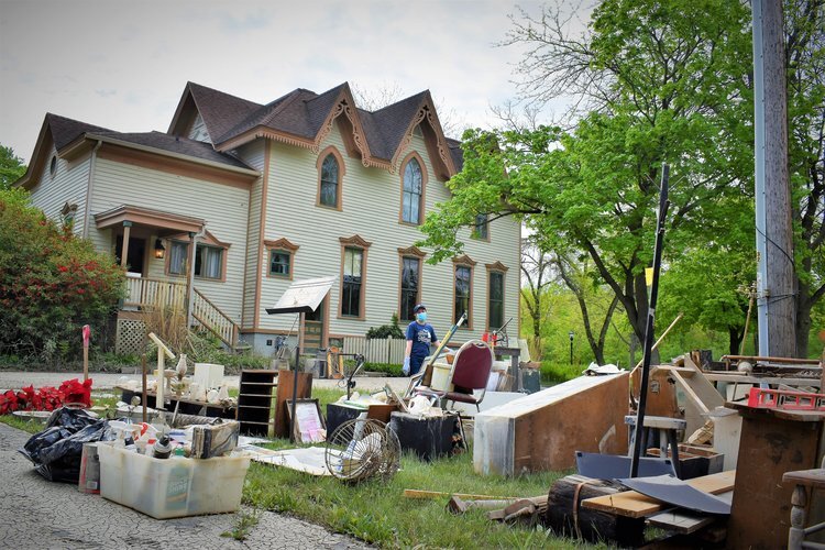 Items sorted on the lawn of the historic Bradley Home.