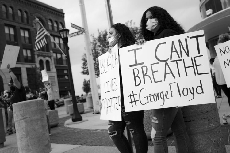 Many of the signs carried by participants in Bay City's protest mentioned George Floyd, the African American man who died May 25 after being restrained by a Minneapolis police officer. Photo credit: Phil Eich, Full Steam Social Media