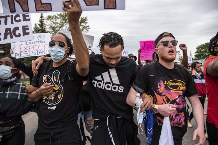 (From left to right) Gil Melvin, Rondo Sanders and Steven Green march toward downtown Mount Pleasant during an event to protest the death of George Floyd and social injustice June 1 on Mission Street in Mt. Pleasant, MI.