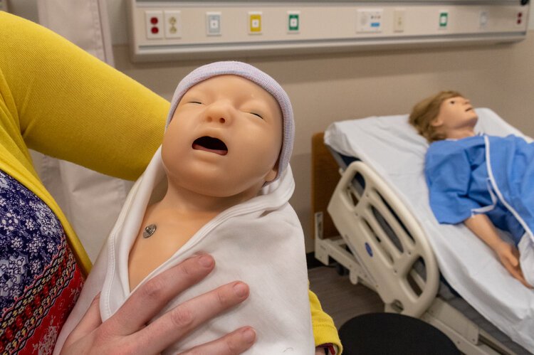 The infant mannequin will turn blue in the face if its head is held incorrectly in the IPEP Center.