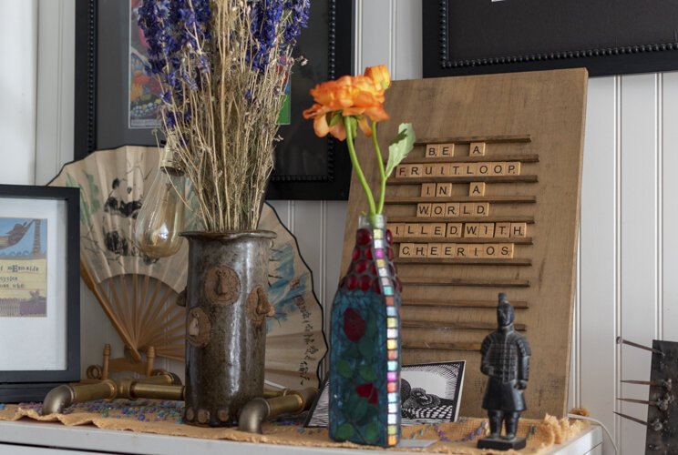 A sign which reads 'Be a fruit loop in a world filled with cheerios' exemplifies Bergeson's outlook on life. 