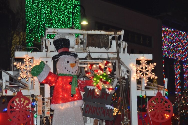 The light parade during the Mt. Pleasant Christmas Celebration illuminates the streets of downtown Mt. Pleasant with holiday-themed floats.