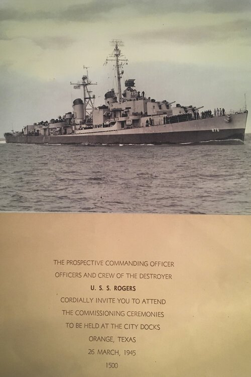 A photo of the USS Rogers and invitation to its commissioning.