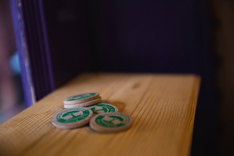 To encourage customers to bring their own bags, Green Tree Cooperative Grocery has implemented a Wooden Nickel program.  