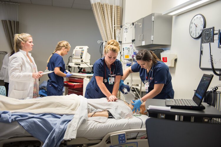 Students in Saginaw Valley State University's nursing program practice hands-on skills in a lab setting