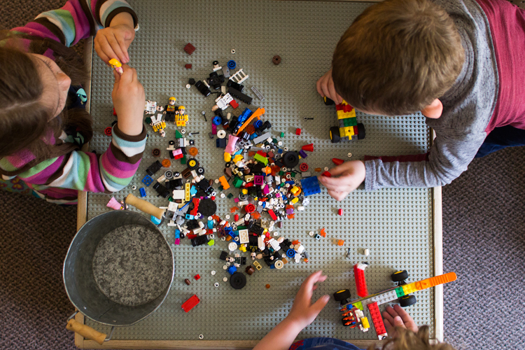 Classmates play at the lego station in the ICDC classroom on May 16, 2019.