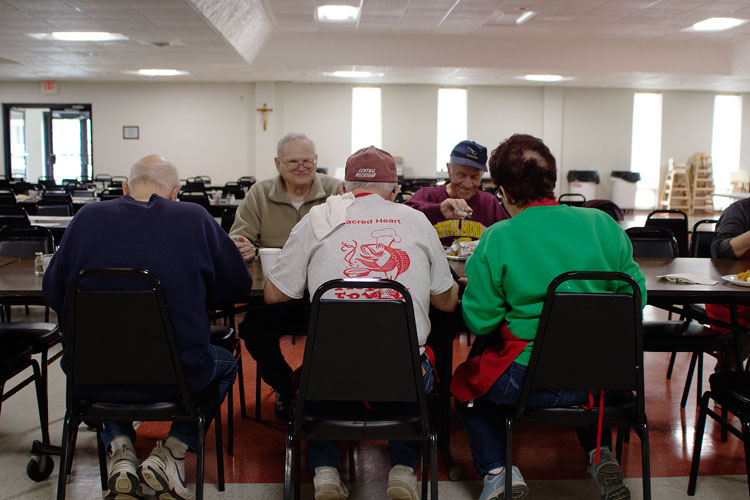 Volunteers enjoy lunch together after completing prep for the week's Fish Fry at Mt. Pleasant Sacred Heart