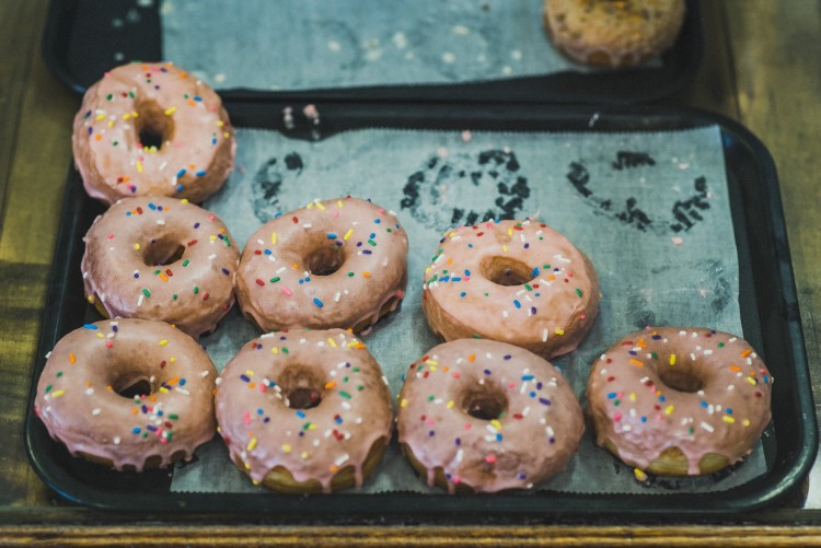 Getting a batch glazed and ready for customers.