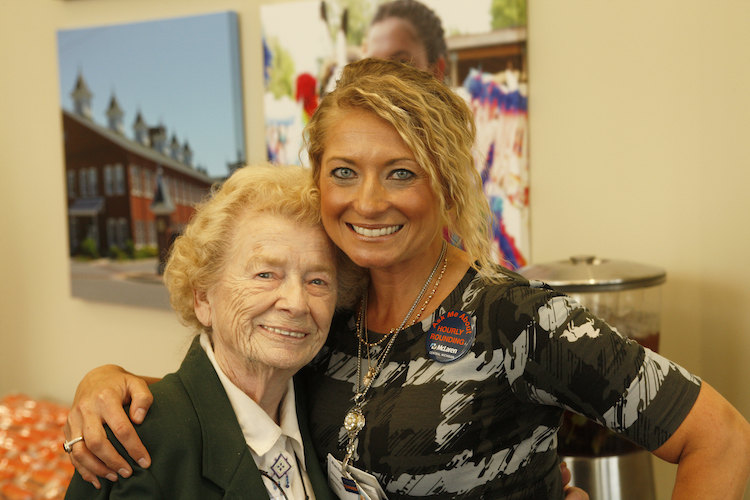 Volunteer Shirley Decker and Rachel Blizzard, Director of Marketing and Fund Development at McLaren Central Michigan, pose for a photo during the ribbon cutting ceremony for the hospital's emergency department, 2017.