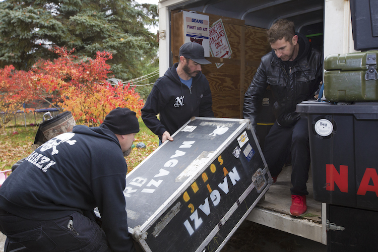 Nagazi band members Doug McGuire, Jeff Hafer, and Joe Hafer load band equipment into their trailer before leaving for their "Unleashed" tour on Thursday, Nov. 8, 2018.