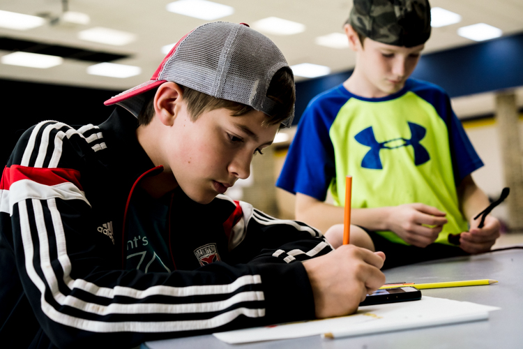 Two boys draw at PEAK after school