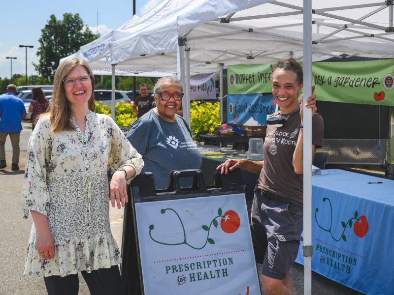 Ariane Donnelly, Anne Davis, and Tanya Andrews at the Prescription for Health booth at the Pittsfield Township Farmers Market. Prescription for Health is Washtenaw County's produce prescription program.