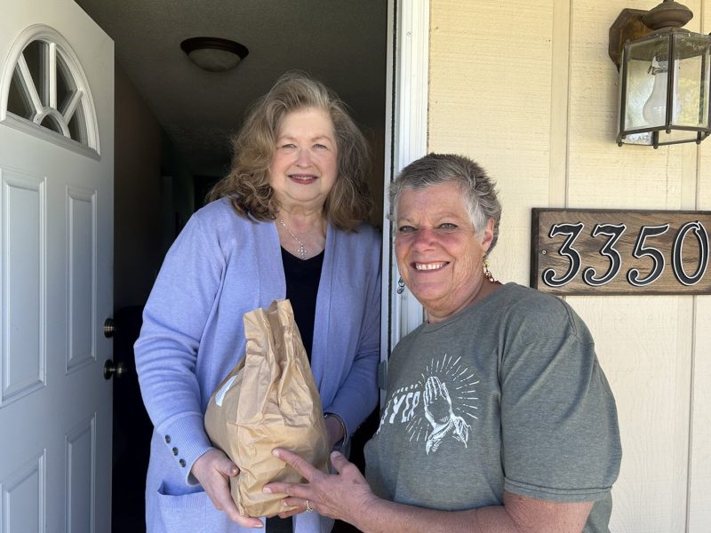A Meals on Wheels Western Michigan volunteer makes a delivery.