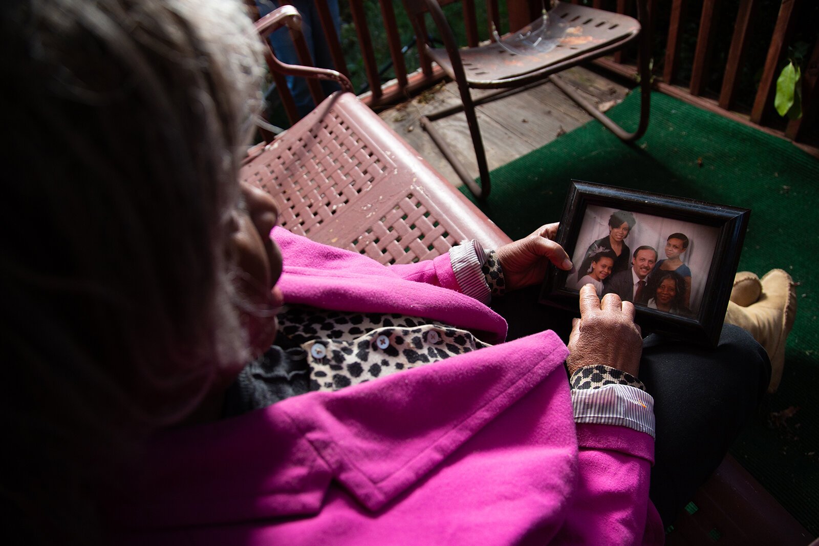 Yvonne Woodard holds a family photo.