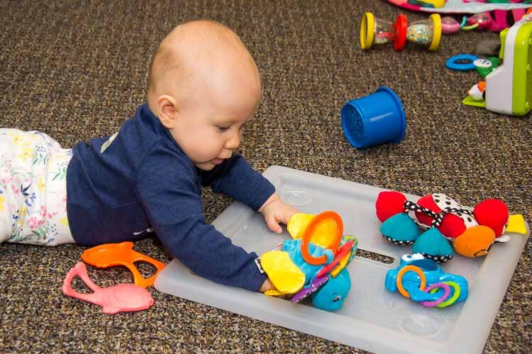 A child plays at the Kalamazoo Drop-In Child Care Center.