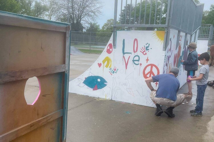 Community members painted ramps during the Paint and Skate event at the Island Park skatepark in downtown Mt. Pleasant on Saturday, May 13, 2023. (Photo courtesy of Megan Bair)