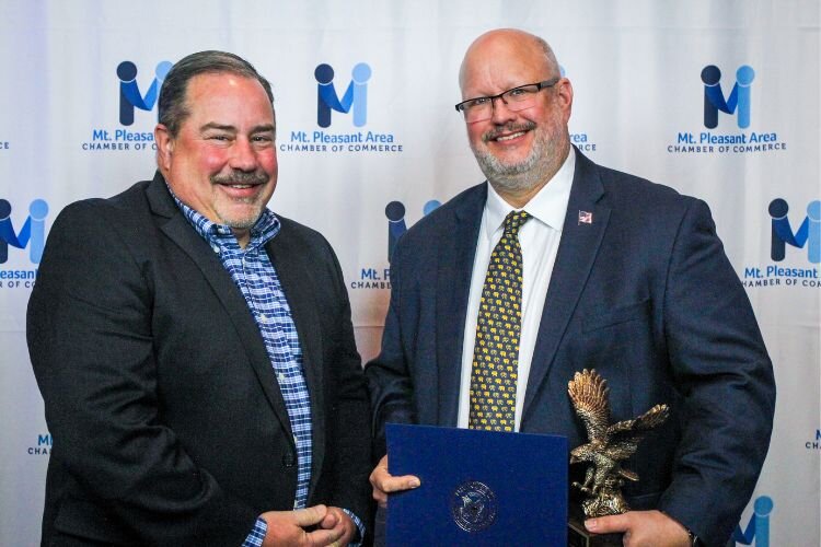 Matt Showalter accepted his Eagle Award from Doug Ouelletete with Mercantile Bank, as the Mt. Pleasant Area Community Foundation’s 2024 Shirley M. Decker Eagle Award recipient.