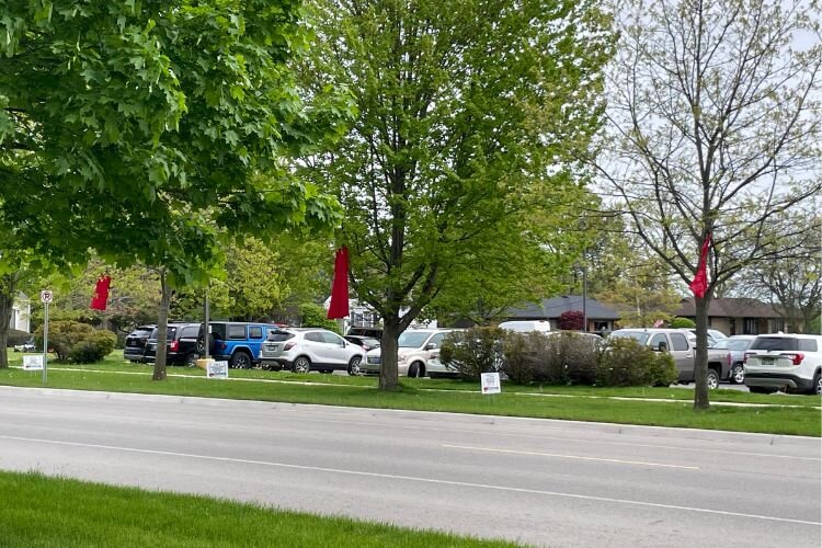 Red Dresses line the streets of Mt. Pleasant during the “No More Stolen Sisters” movement.
