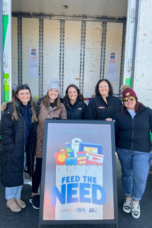 Claire Doty with community members during Feed the Need.